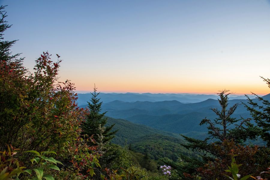 Layers of blue ridgelines at dusk from a Blue Ridge Parkway overlook