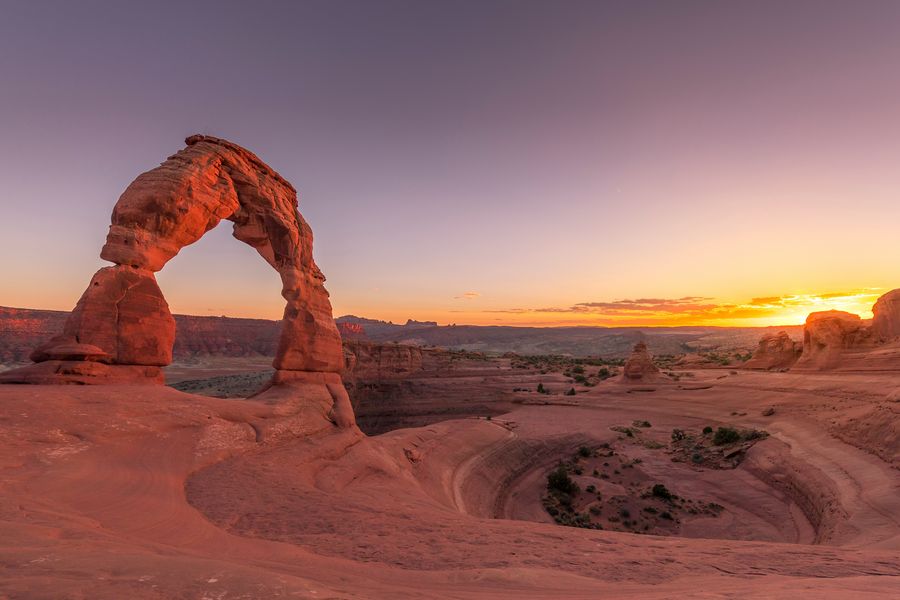 Delicate Arch glowing at sunset in Arches National Park near Moab, Utah