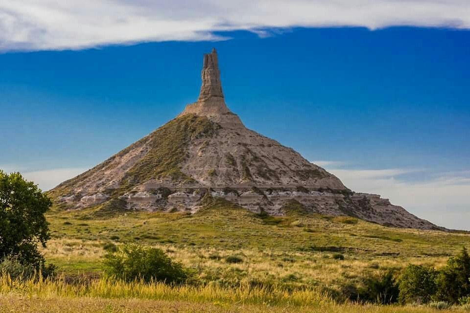 Chimney Rock rising above grassland