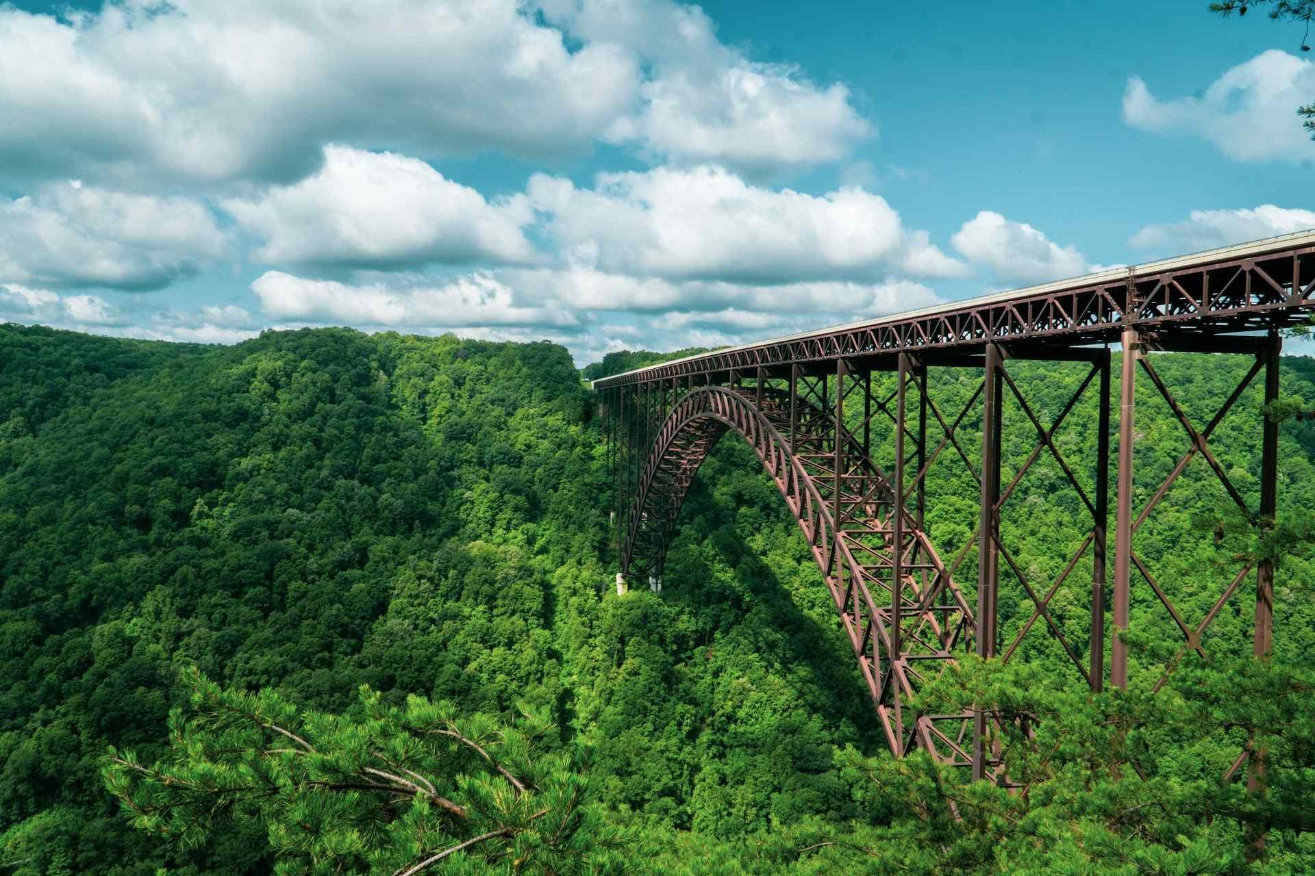 New River Gorge Bridge above forested hills